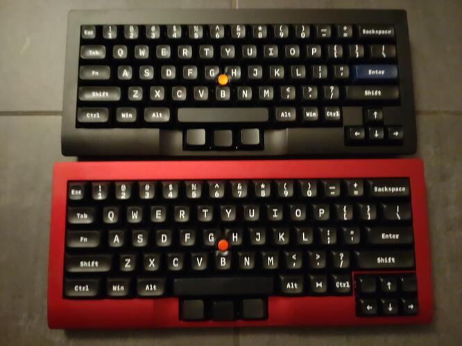 A black and a red Tex Shura 60% with separate cursor block and thumbstick